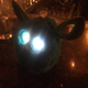 Furby at a bar, with its antenna at the top.